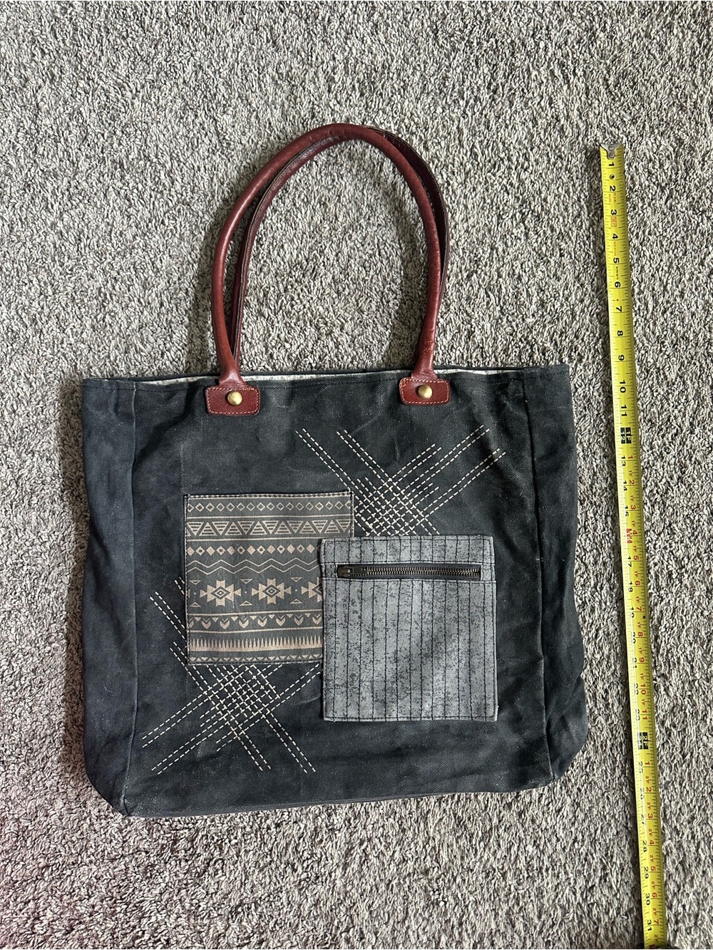 Mono B Black Canvas Tote with Brown Handles and Patterned Front Pockets